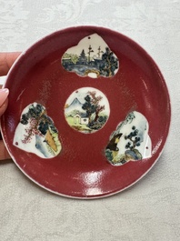 Two Chinese famille rose ruby-ground 'Landscape Scroll' cups and saucers, Yongzheng
