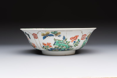 A Chinese famille verte bowl with bird and butterflies among flowers, lozenge mark, Kangxi