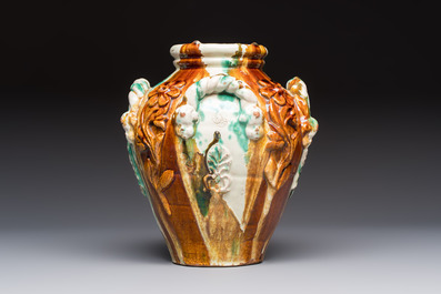 A polychrome Saintonge pottery vase with rope twist handles and mascarons, France, 17th C.