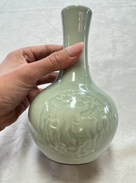 A pair of Chinese celadon-glazed bottle vases with incised phoenix design, Yongzheng mark, 19th C.