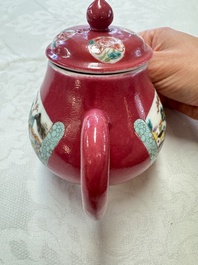 A Chinese famille rose ruby-ground 'Landscape Scroll' teapot and stand, Yongzheng