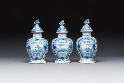 A rare Chinese blue and white five-piece garniture in Dutch Delft style, Kangxi mark, 19th C.
