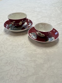 Two Chinese famille rose ruby-ground 'Landscape Scroll' cups and saucers, Yongzheng