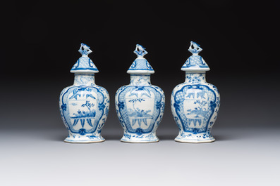 A rare Chinese blue and white five-piece garniture in Dutch Delft style, Kangxi mark, 19th C.