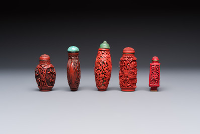 Nine Chinese cinnabar lacquer snuff bottles and a covered box, Qianlong marks, 19/20th C.