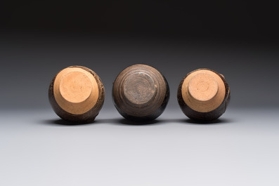 Three khmer-style brown-glazed anthropomorphic gourd-form bottles, probably 12/13th C.