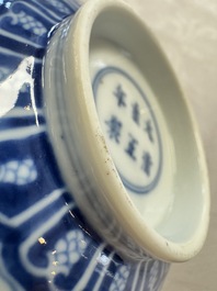 A pair of Chinese blue and white 'lotus scroll' bowls, Yongzheng mark and of the period
