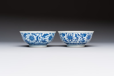 A pair of Chinese blue and white 'lotus scroll' bowls, Yongzheng mark and of the period