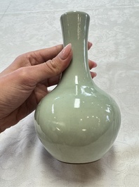 A pair of Chinese celadon-glazed bottle vases with incised phoenix design, Yongzheng mark, 19th C.