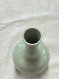 A pair of Chinese celadon-glazed bottle vases with incised phoenix design, Yongzheng mark, 19th C.