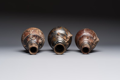 Three khmer-style brown-glazed anthropomorphic gourd-form bottles, probably 12/13th C.