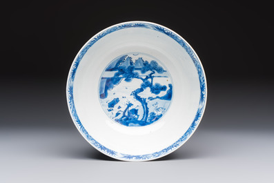 A Chinese blue and white bowl with scholars among cranes and deer, Kangxi mark and of the period