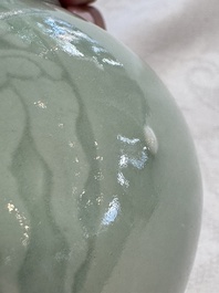 A pair of Chinese celadon-glazed bottle vases with incised phoenix design, Yongzheng mark, 19th C.