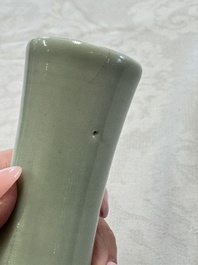 A pair of Chinese celadon-glazed bottle vases with incised phoenix design, Yongzheng mark, 19th C.