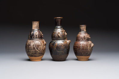 Three khmer-style brown-glazed anthropomorphic gourd-form bottles, probably 12/13th C.