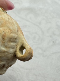 A pair of Chinese bird feeders with moulded design, one unglazed, on later wooden stands, Song