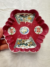 A Chinese famille rose ruby-ground 'Landscape Scroll' teapot and stand, Yongzheng