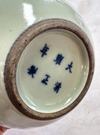A pair of Chinese celadon-glazed bottle vases with incised phoenix design, Yongzheng mark, 19th C.