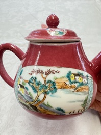 A Chinese famille rose ruby-ground 'Landscape Scroll' teapot and stand, Yongzheng