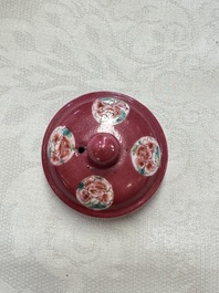 A Chinese famille rose ruby-ground 'Landscape Scroll' teapot and stand, Yongzheng