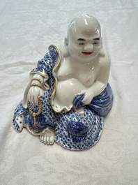 A Chinese blue and white, iron-red and gilt-decorated Milefo Buddha, Fu Jian Hui Guan 福建會館 and You Lin Ji Zhi 游林記製 marks, 20th C.