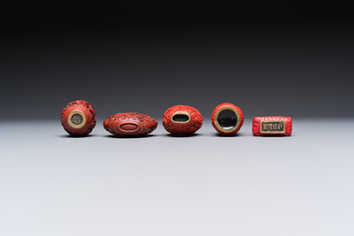 Nine Chinese cinnabar lacquer snuff bottles and a covered box, Qianlong marks, 19/20th C.