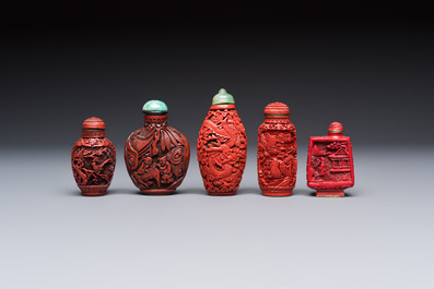 Nine Chinese cinnabar lacquer snuff bottles and a covered box, Qianlong marks, 19/20th C.