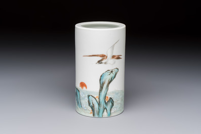 A Chinese polychrome brush pot with a bird standing on rockwork amid waves, Qianlong mark, 20th C.