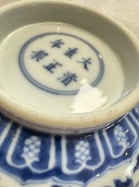 A pair of Chinese blue and white 'lotus scroll' bowls, Yongzheng mark and of the period