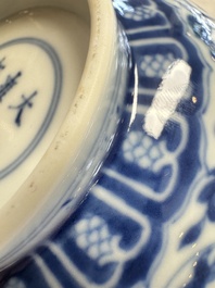 A pair of Chinese blue and white 'lotus scroll' bowls, Yongzheng mark and of the period