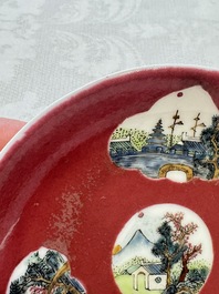 Two Chinese famille rose ruby-ground 'Landscape Scroll' cups and saucers, Yongzheng