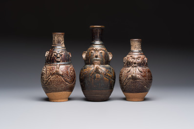 Three khmer-style brown-glazed anthropomorphic gourd-form bottles, probably 12/13th C.