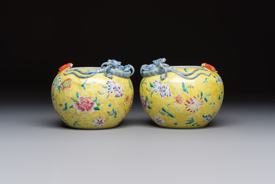 A pair of Chinese famille rose yellow-ground water pots with floral design and applied chilong and bats, Qianlong mark, 19/20th C.