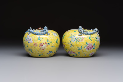 A pair of Chinese famille rose yellow-ground water pots with floral design and applied chilong and bats, Qianlong mark, 19/20th C.