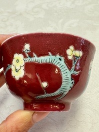 Two Chinese famille rose ruby-ground 'Landscape Scroll' cups and saucers, Yongzheng