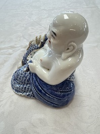 A Chinese blue and white, iron-red and gilt-decorated Milefo Buddha, Fu Jian Hui Guan 福建會館 and You Lin Ji Zhi 游林記製 marks, 20th C.