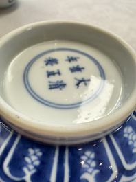 A pair of Chinese blue and white 'lotus scroll' bowls, Yongzheng mark and of the period
