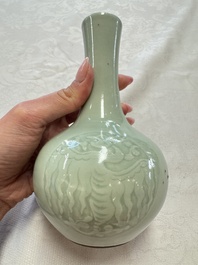A pair of Chinese celadon-glazed bottle vases with incised phoenix design, Yongzheng mark, 19th C.