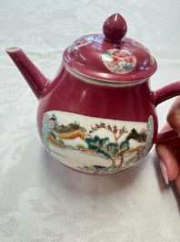 A Chinese famille rose ruby-ground 'Landscape Scroll' teapot and stand, Yongzheng