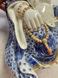 A Chinese blue and white, iron-red and gilt-decorated Milefo Buddha, Fu Jian Hui Guan 福建會館 and You Lin Ji Zhi 游林記製 marks, 20th C.