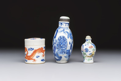A Chinese iron-red 'Dragon' covered box, a blue and white '100 Boys' and a famille verte 'Fish' snuff bottle, Shunzhi mark, 19th C.