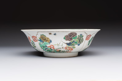 A Chinese famille verte bowl with bird and butterflies among flowers, lozenge mark, Kangxi