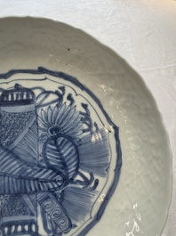 A Chinese blue and white plate with a relief-moulded rim, Wanli