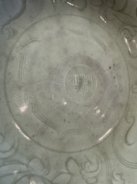 A Chinese Longquan celadon inscribed dish with incised floral design, Ming