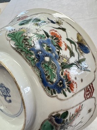 A Chinese famille verte bowl with bird and butterflies among flowers, lozenge mark, Kangxi