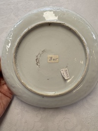 A Chinese blue and white plate with a relief-moulded rim, Wanli