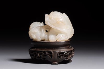 A Chinese carved jade 'Buddhist Lions' group, 19th C.