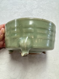 A Chinese Longquan celadon 'Bagua' tripod censer, Ming