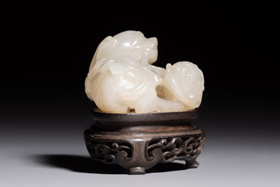 A Chinese carved jade 'Buddhist Lions' group, 19th C.