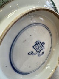 A Chinese famille verte bowl with bird and butterflies among flowers, lozenge mark, Kangxi